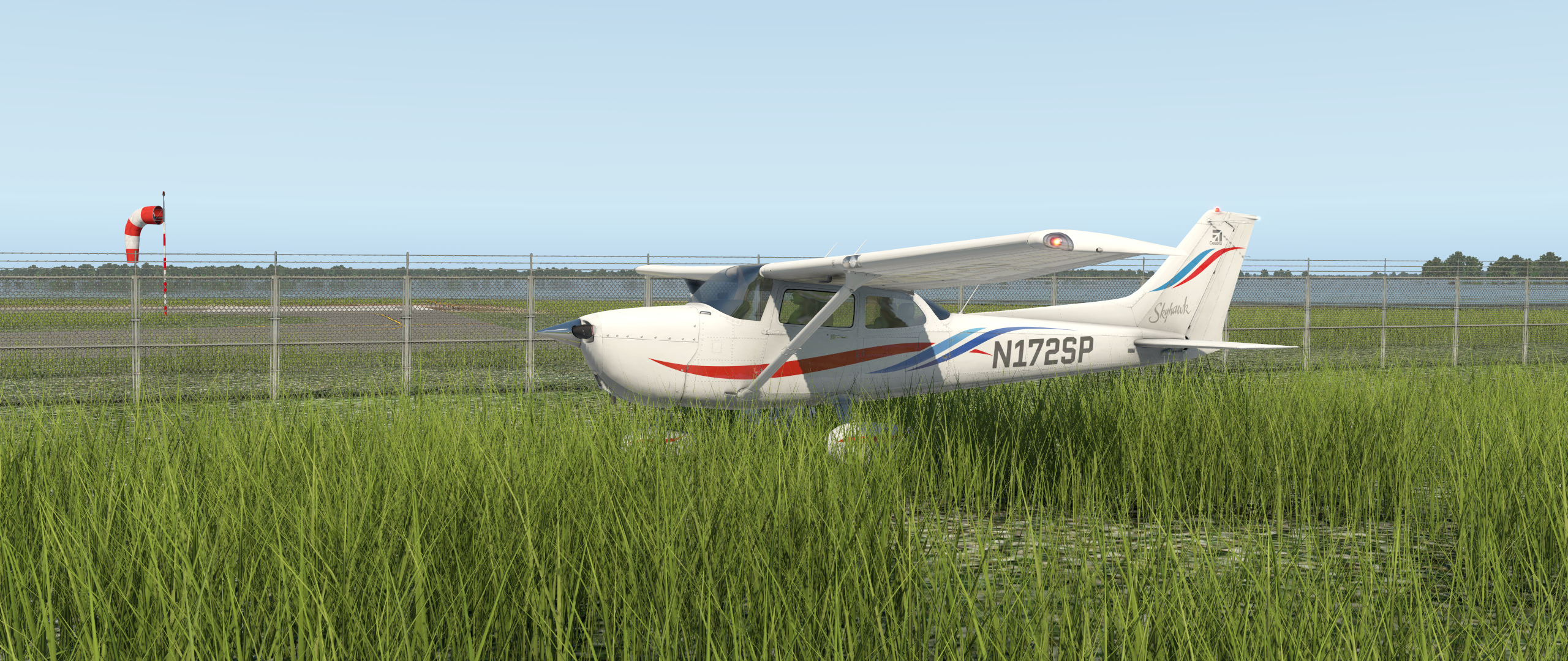 AliveGrass X-Plane 11 screenshot with a white Skyhawk in sunlit grass